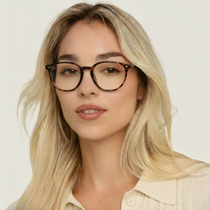 Woman wearing tortoiseshell round glasses